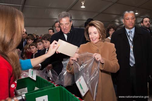 Nancy Pelosi, Speaker of the U.S. House of Representatives, joins thousands of volunteers to prepare care packages for troops sattioned in Iraq during Serve DC's Operation Gratitude project for the 2009 Martin Luther King, Jr. Day of Service in Washington, DC.  Fueled by President Obama’s call to service, the 2009 Martin Luther King, Jr. Day of Service experienced a historic level of participation, as Americans across the country honored Dr. King by serving their communities on the January 19 King Holiday. In total, more than 13,000 projects took place -- the largest ever in the 14 years since Congress encouraged Americans to observe the King Holiday as a national day of service and charged the Corporation for National and Community Service with leading this national effort.