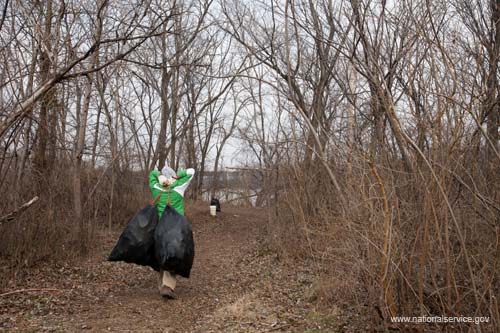 A young volunteer hauls off trail debris during the Student Conservation Association's Martin Luther King, Jr. Day of Service trail clearing project on Kingman Island in Washington, DC.  Fueled by President Obama’s call to service, the 2009 Martin Luther King, Jr. Day of Service experienced a historic level of participation, as Americans across the country honored Dr. King by serving their communities on the January 19 King Holiday. In total, more than 13,000 projects took place -- the largest ever in the 14 years since Congress encouraged Americans to observe the King Holiday as a national day of service and charged the Corporation for National and Community Service with leading this national effort.