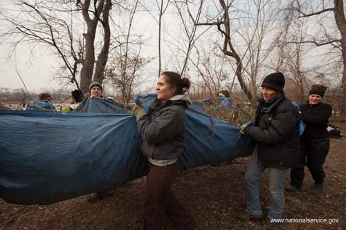 SCA volunteers collectively carry trail debris during the Student Conservation Association's 2009 Martin Luther King, Jr. Day of Service on Kingman Island in Washington, DC.  Fueled by President Obama’s call to service, the 2009 Martin Luther King, Jr. Day of Service experienced a historic level of participation, as Americans across the country honored Dr. King by serving their communities on the January 19 King Holiday. In total, more than 13,000 projects took place -- the largest ever in the 14 years since Congress encouraged Americans to observe the King Holiday as a national day of service and charged the Corporation for National and Community Service with leading this national effort.