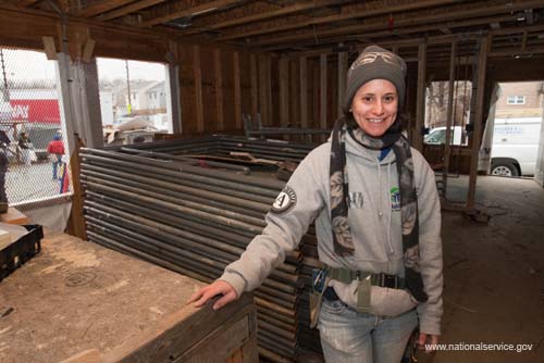 AmeriCorps member Rachael Leese shows off the interior of a Habitat home being built during the 2009 Martin Luther King, Jr. Day of Service in Washington, DC.  Fueled by President Obama’s call to service, the 2009 Martin Luther King, Jr. Day of Service experienced a historic level of participation, as Americans across the country honored Dr. King by serving their communities on the January 19 King Holiday. In total, more than 13,000 projects took place -- the largest ever in the 14 years since Congress encouraged Americans to observe the King Holiday as a national day of service and charged the Corporation for National and Community Service with leading this national effort.
