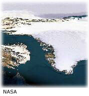 عكس
ماهواره‌اي گرينلند
كه توده‌هاي
يخي را نشان
مي‌دهد. 
