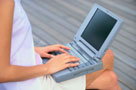 Image of woman typing on laptop computer