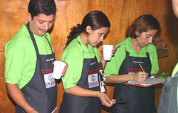 Ingrid Cornejo and fellow graduates demonstrate their skills as junior cuppers, at the USAID-financed coffee cooperative laboratory in Jinotega, Nicaragua.