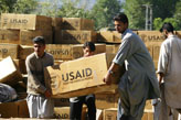 Earthquake-affected Pakistanis receive USAID humanitarian relief commodities (GOAL).