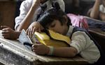 A Kashmiri girl sleeps in a classroom in Srinagar August 27, 2007. REUTERS/Danish Ismail