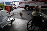 A resident of Key West Convalescent Center waits to be evacuated in preparation for Hurricane Ike in Key West, Florida September 7, 2008. REUTERS/Carlos Barria