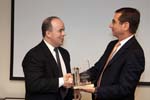 Corporation board chair Alan Solomont congratulates outgoing board member Vince Juaristi for his service to the agency. On February 4, 2009, the Corporation for National and Community Service held a public board meeting at the Corporation's Washington, DC headquarters.