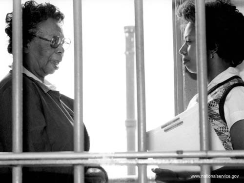 Assigned to the Missouri Division of Corrections in July 1980, VISTA member Rose T. Evans, 69, counsels inmate Linda Jack at Renz Correctional Center in Cedar City. Evans, a retired school teacher, recruits and trains community volunteers and inmates to provide activities in music, dance, sewing, crafts, cosmetology, and correspondence for the prisoners.
<P> </P>