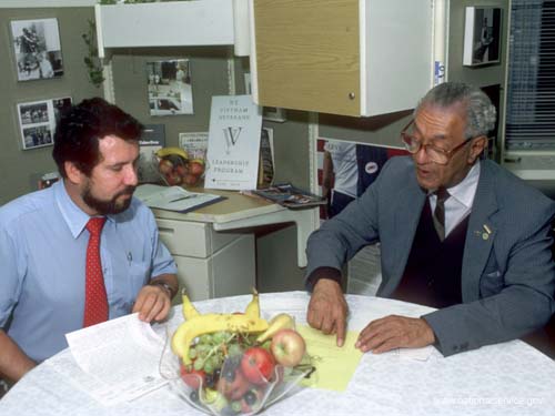 In 1986, VISTA members Alejandro Cruz and James Campbell plan activities for the Vietnam Veterans Leadership Program in New York City.