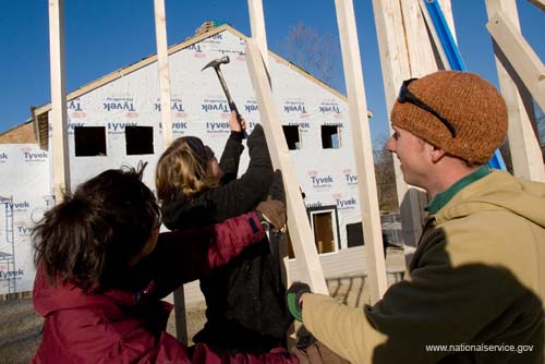 Dozens of new homes will soon fill a Washington, D.C. neighborhood courtesy of Habitat for Humanity, AmeriCorps, and volunteers like these who spent 2008 Martin Luther King Day serving at the house build. About 20,000 people in the District of Columbia participated in nearly 150 service projects in honor of the slain civil rights leader on January 21, 2008.