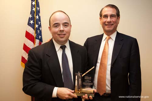 Corporation board chair Alan Solomont congratulates outgoing board member Vince Juaristi for his service to the agency.  On February 4, 2009, the Corporation for National and Community Service held a public board meeting at the Corporation's Washington, DC headquarters.