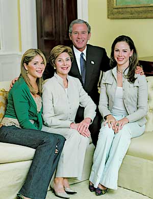 Posing for a family photo for Good Housekeeping magazine in the West Sitting Hall of the White House, July 13.