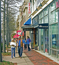 Different color paving illustrates safe walking areas in commercial sidewalks. 