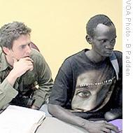 Justin Zorn (left) and Makwei Deng work on a Banaa project