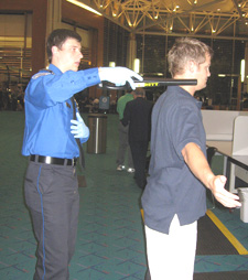 photo of TSA screening a passenger