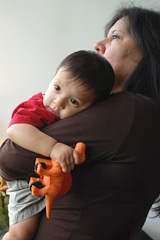 woman holding child - photo by Kristin Beadle