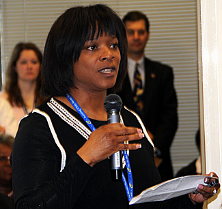 Supervisory TSO Sonja Armstrong of Show Low (Ariz.) Regional Airport, on a 30-day detail with the IdeaFactory, poses a question to senior leadership at a town hall forum April1 at headquarters.