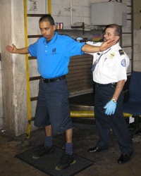 Photo of an airport employee being screened