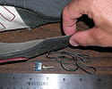 Photo of a device hidden in the sole of a running shoe