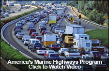 Photo: Trucks in traffic on the highway.