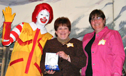Kathie Howell (middle) is honored as 2008 Volunteer of the Year at the Ronald McDonald Family Room 

at Colorado Spring Memorial Hospital.