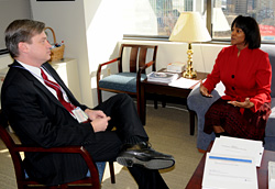 Supervisory TSO Sonja Armstrong talks with Security Operations Assistant Administrator Lee Kair at headquarters.
