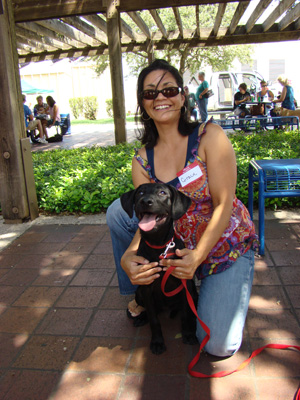 Photo of volunteer Grace Matcek with puppy Gilly