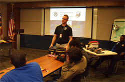 Bomb Appraisal Officer Chris Stoup shows an improvised explosive device bag that he created.