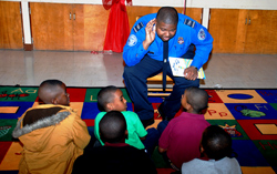 TSO Jessie Anthony reads to students.