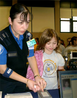 TSO Raquel Castaneda takes a child’s fingerprint as part of the safety initiative.