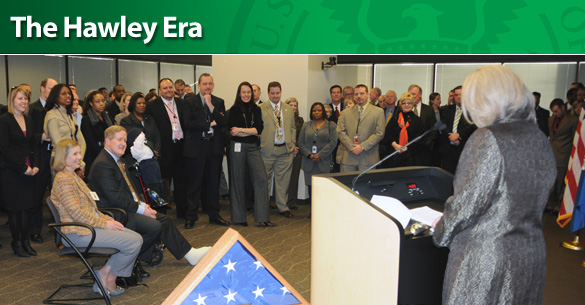 TSA employees participate in a farewell event for Administrator Kip Hawley (seated) and his wife, Janet (to Hawley's right), at headquarters Jan. 12