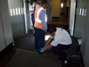 photo of airline employee and aircraft screening at Los Angeles International Airport