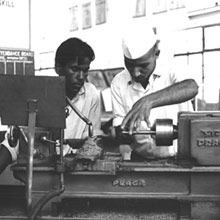 A young man learning to operate an engine lathe at the Industrial Training Institute in Kanpur, New Delhi, 1968.