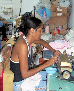 Dominican Republic: Seamstress at a small clothing manufacturer in Villa
Pantis, La Romana, Dominican Republic Credit: DTS