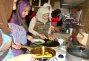 Young women from the Beddawi area learn how to cook traditional Lebanese and Palestinian dishes during an OTI-supported class.