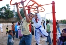Lebanese and Palestinian children play in a new playground developed by an OTI partner in the southern Lebanon community of Burghliyeh.