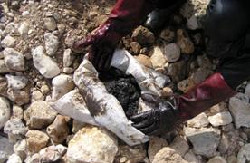 Photos show the manual recoveryby of submerged in front of the Byblos sandy beach.