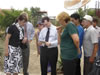 Saglyk community members shared photos and stories with Assistant Secretary Feigenbaum during his visit
