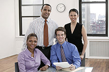 photo of business people sitting with a desk