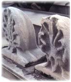 Picture of stone sculpture that has been damaged by acid rain and fog. 