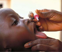 Photo of a child receiving polio vaccination drops. Source: WHO.