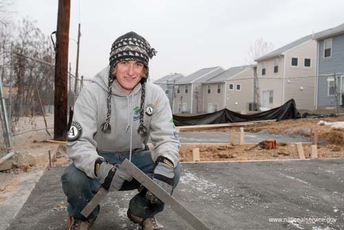 AmeriCorps member Joe Abbott volunteers at 2009 Martin Luther King, Jr. Day Habitat for Humanity build in Washington, DC.  Fueled by President Obama’s call to service, the 2009 Martin Luther King, Jr. Day of Service experienced a historic level of participation, as Americans across the country honored Dr. King by serving their communities on the January 19 King Holiday. In total, more than 13,000 projects took place -- the largest ever in the 14 years since Congress encouraged Americans to observe the King Holiday as a national day of service and charged the Corporation for National and Community Service with leading this national effort.