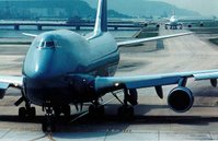 A 747 passenger jet taxi's down the runway.