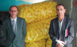 Photo: A USAID loan allowed Bajram Abdullahu and Sylejman Topanica to purchase equipment to produce marketable plastic bottles. 