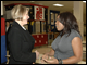 Secretary Spellings greets Melinda Dolittle, singer from American Idol, at Midtown West School.