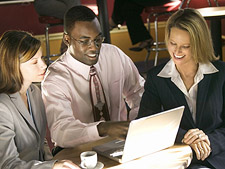 Business people sitting with a laptop