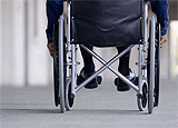 photo of a wheelchair in an airport terminal