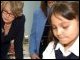 Secretary Spellings watches students complete an assignment during the after-school program at PS 150.