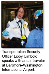 Transportation Security Officer Libby Cimbolo speaks with an air traveler at the Baltimore-Washington International Airport.