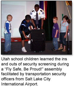 Children learn how to screen bags during a Fly Safe, Be Proud assembly.